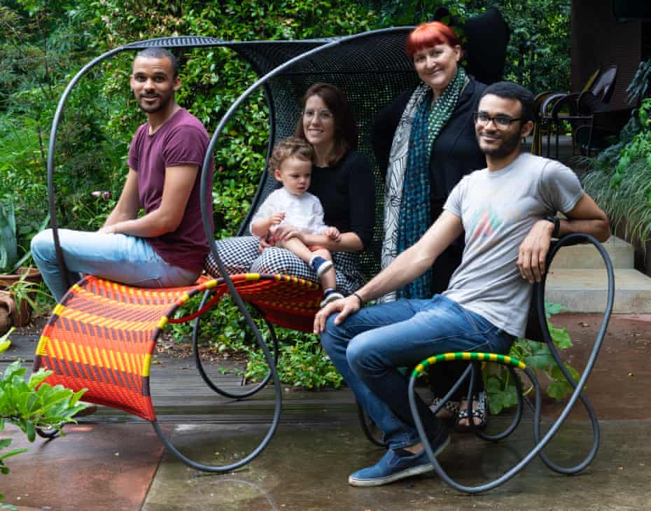 A family affair: Patrizia Moroso with her sons Armin and Omar and her grandchild Mattia in the garden – the two seats belong to the Modou collection by Ron Arad, 2019, Moroso.