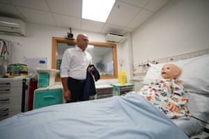 London, UK. The health secretary, Sajid Javid, looking at a simulated patient during a visit to Great Ormond Street hospital