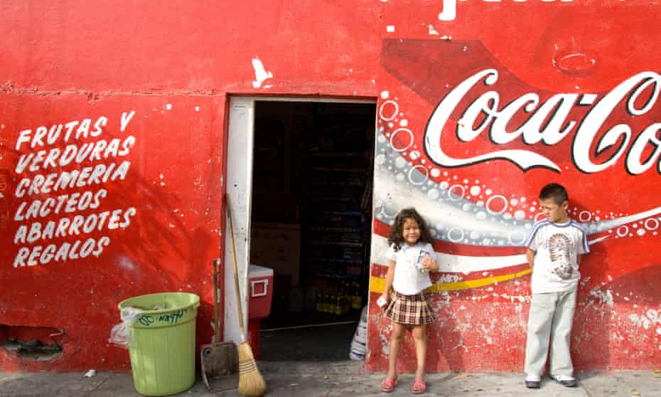 Two children outside a local market in Mazatlan, Mexico