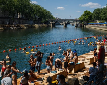 People swim and sunbathe at the Bras Marie safe bathing site