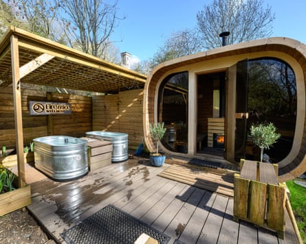 A sauna on decking on a sunny day.