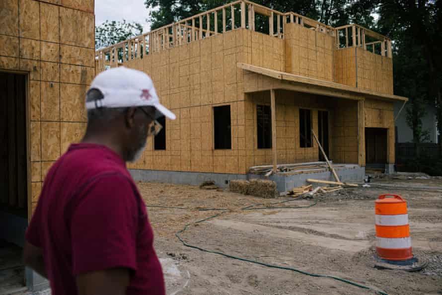 Suffolk, VA -- Pughsville-Suffolk Civic League president Wayne White looks at a new building in his historic African American community.