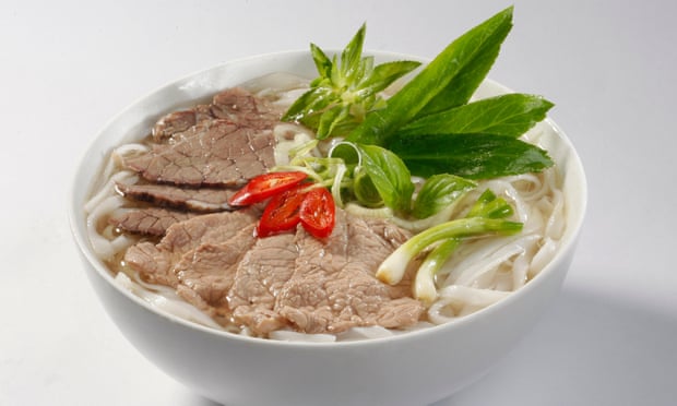 A bowl of phở, a Vietnamese dish comprising rice noodles, beef and fresh herbs