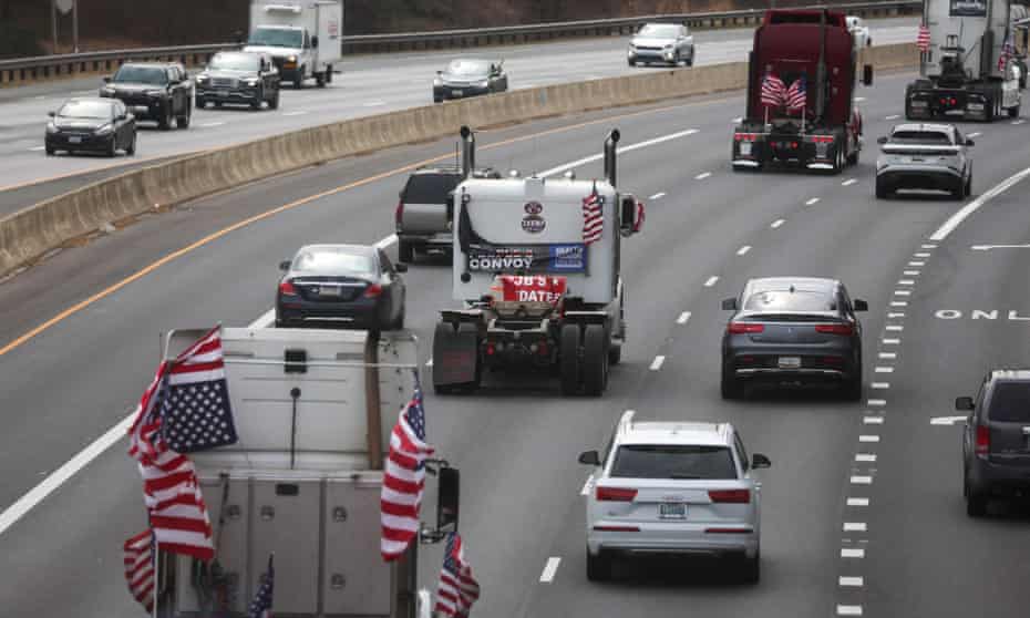 Truckers and their supporters make their way to drive around the Washington DC beltway, on Sunday.