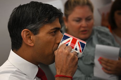 Rishi Sunak drinking from a mug with a union jack design