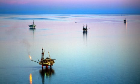 Oil rigs in the Cook Inlet oil field of Alaska. ‘Doubling down on fossil fuels is a false solution that only perpetuates the problem.’