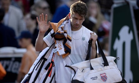 Cameron Norrie walks off after losing to Pavel Kotov.