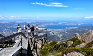 Sightseers take in the view of Hobart from the lookout on top of Mount Wellington