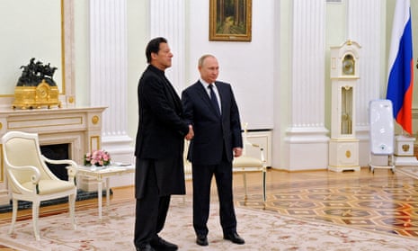 Vladimir Putin shakes hands with Pakistan’s prime minister, Imran Khan, in Moscow on 24 February