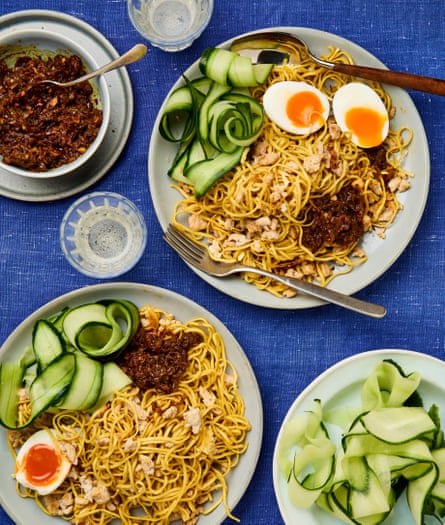 Ranie Saidi’s mee raja (king noodles) on two plates with halved boiled eggs and shaved cucumber.
