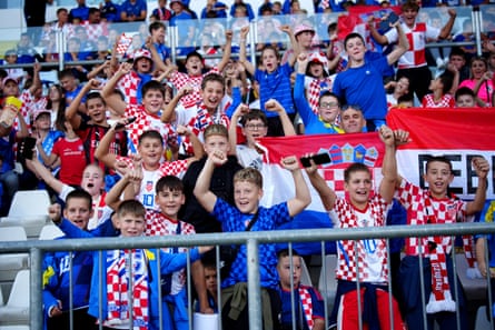 Young Croatia fans watch the England game