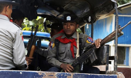 Myanmar police officers patrol Maungdaw, Rakhine State, Myanmar, in the wake of October’s attacks.