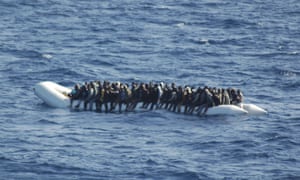 People on a dinghy off the coast of Lampedusa