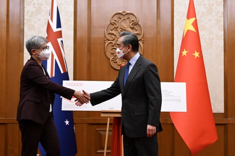 Penny Wong and Chinese foreign minister Wang Yi shake hands during their talks in Beijing in December