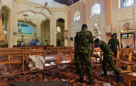 Security personnel inspect St Sebastian’s church in Negombo on 22 April 2019, a day after the church was hit in series of bomb blasts targeting churches and luxury hotels in Sri Lanka.