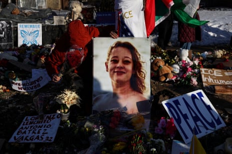Flowers, toys and signs lie at a makeshift memorial at the site of the fatal shooting of Renee Nicole Good
