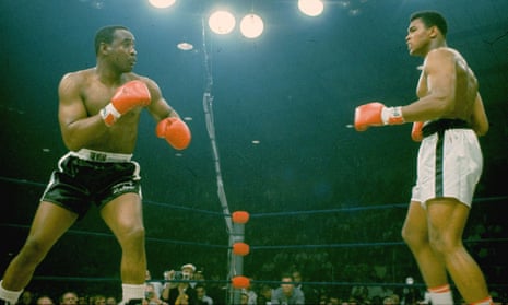 Sonny Liston, in black trunks, just as he is felled by Muhammad Ali’s ‘phantom punch’ in May 1965.