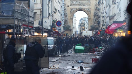 Clashes erupt with French police outside scene of deadly shooting in Paris – video