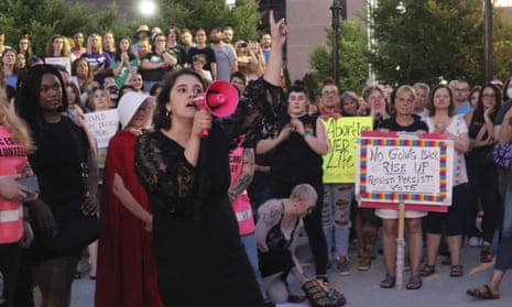 Women's Health Center of West Virginia’s executive director, Katie Quinonez, speaks to a crowd at a vigil outside the federal courthouse in Charleston, West Virginia, on 24 June.