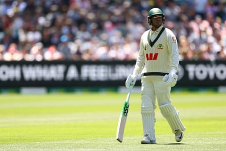 Usman Khawaja walks from the MCG after being dismissed for a duck as Australia collapse to lose the fourth Ashes Test against England
