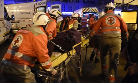 French Red Cross rescue workers evacuate an injured person