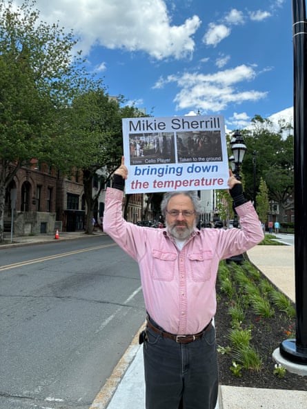 a man holding a sign