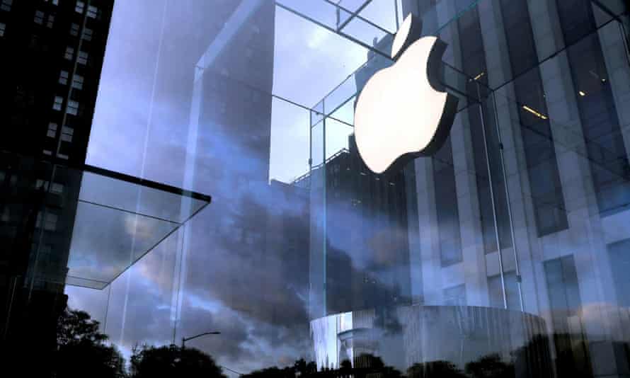 The Apple Inc logo is seen hanging at the entrance to the Apple store on 5th Avenue in Manhattan, New York