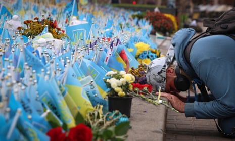 A woman reacts during the All-National minute of silence in commemoration of Ukrainian soldiers killed in the country's war against Russia on Independence square in Kyiv, Ukraine, Sunday, Oct. 1, 2023. Ukraine commemorates veterans and fallen soldiers on Sunday. The date of the annual Day of the Defenders was moved from 14th October as part of the reforms of the church calendar introduced by President Volodymyr Zelenskyy.