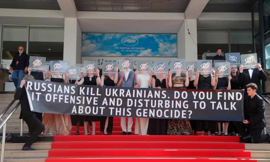 Seeing red… Ukrainian director Maksym Nakonechnyi, centre, and members of the cast and crew of Butterfly Vision at Cannes.
