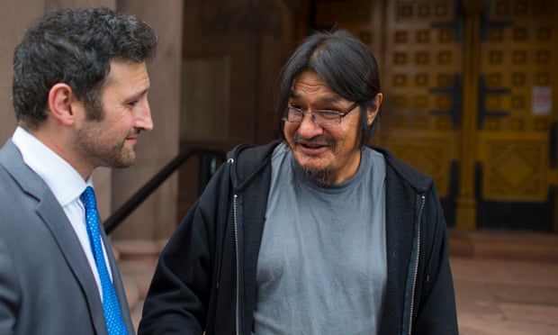 Law student Daniel Ciarabellini, left, is thanked by his client Gerry Williams outside Old City Hall court after having about C$65,000 in fines reduced to zero.