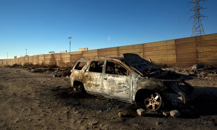 Pprototypes of the wall are seen on the US side of the border. In the Mexican side of Otay, the carcass of a burned vehicle lays where drug-violence has led more than a thousand dead people just in 2017.