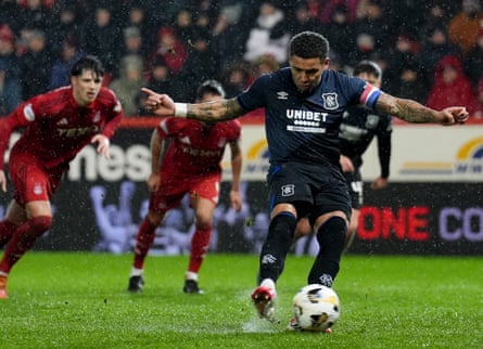 Rangers' James Tavernier scores his side's second goal from the penalty spot.