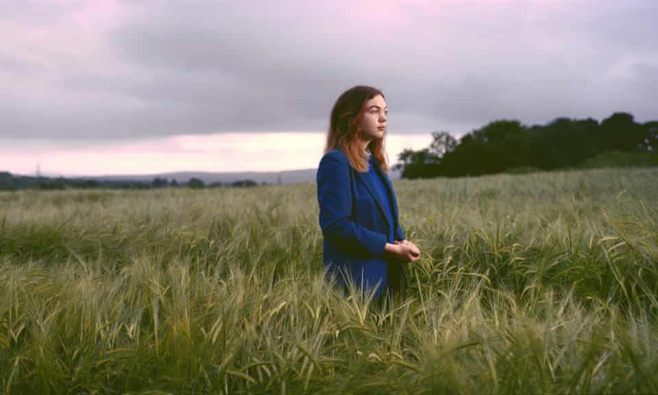 Schoolgirl Catriona Walsh stands in a barley field along the Irish border in Londonderry, Northern Ireland.