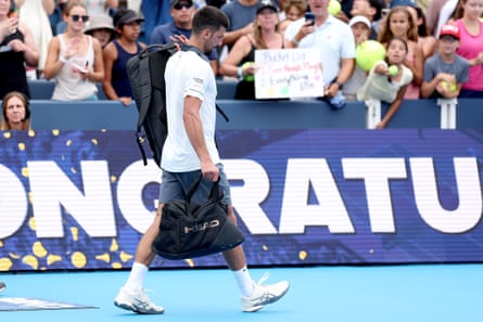 A defeated Novak Djokovic departs the court after losing 2-6, 6-4, 6-4 to Argentine Thiago Agustín Tirante