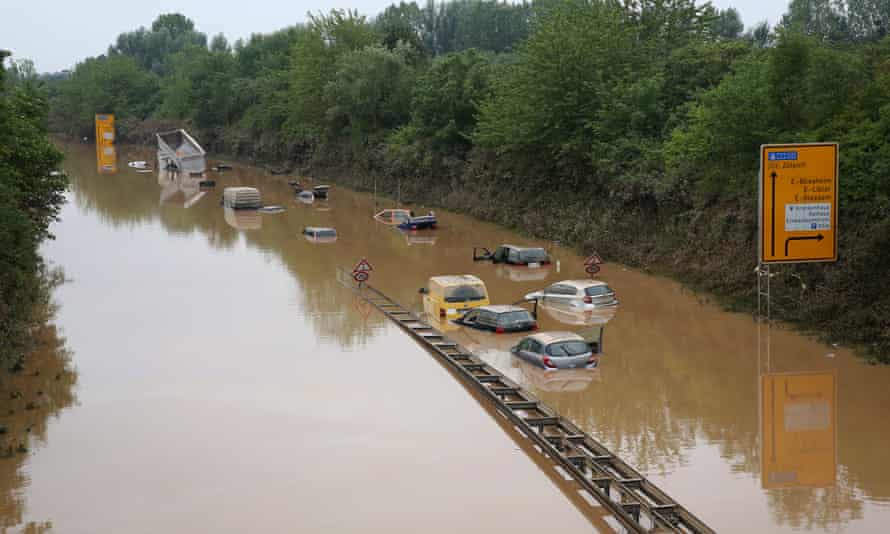 Abandoned vehicles on flooded highway 265 after a landslide caused by a major flood near Erftstad.