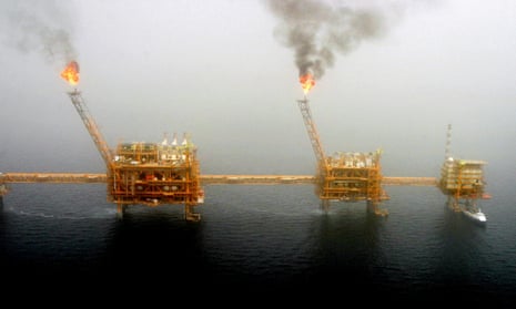 Gas flares from an oil production platform are seen at the Soroush oil fields in the Persian Gulf.