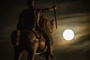 A supermoon rises behind sculpture of Tomislav of Croatia, the first Croatian king, in downtown Zagreb