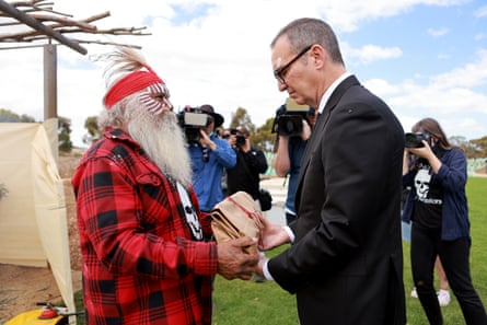 Major “Moogie” Sumner gives former South Australian premier Steven Marshall the first Kaurna remains from the state museum to be laid to rest.