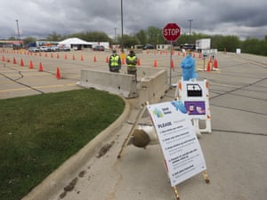 A healthcare worker waits for people to show up to a testing site in Sioux City.