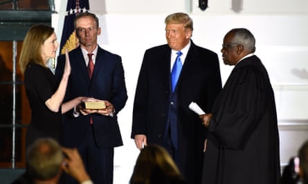 Amy Coney Barrett is sworn in as supreme court justice, the most recent of more than 200 conservative judicial appointments by Donald Trump.