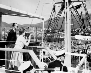Australia, 1954: the Queen films the scene at Prince’s Pier, Hobart, as the SS Gothic arrives in Tasmania, the Duke of Edinburgh watching by her side