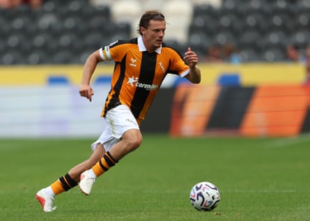 The Hull midfielder Regan Slater runs with the ball during a pre-season game.