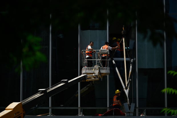 Workers in Beijing’s central business district. Michael Pettis believes China will face a prolonged period of low growth.