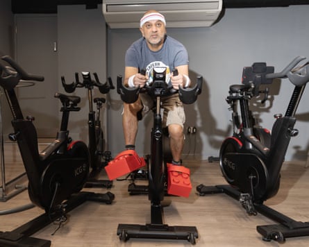 Richie on a spin bike with the crocs