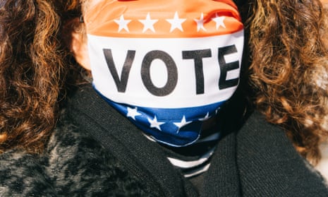 A voter in a mask outside a polling location in Atlanta, Georgia on 5 January 2021.