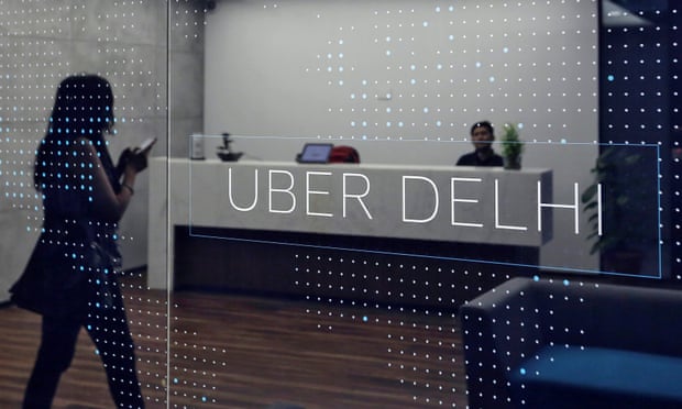 An employee walks inside the office of ride-hailing service Uber in Gurugram, on the outskirts of New Delhi