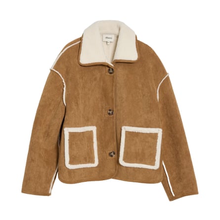 A tan and cream faux sheepskin jacket on a white background