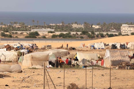Internally displaced Palestinian who have fled their homes in the northern Gaza Strip due to intense Israeli military bombardment, live in makeshift shelters errected on empty ground in Khan Yunis in the southern Gaza Strip on November 11, 2023, amid the ongoing battles between Israel and the Palestinian group Hamas.