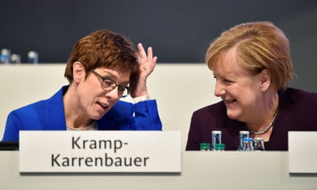 Kramp-Karrenbauer with Merkel at the conference.