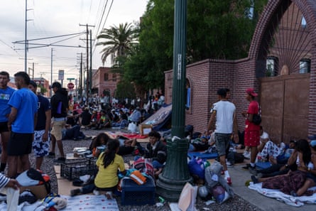 Migrants camp out in front of the Sacred Heart church in advance of the planned 11 May end of Title 42 regulations.